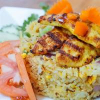 Kao Pad Saparod · Pineapple turmeric fried rice made with your choice of protein.