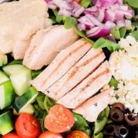 Greek Chicken Salad · baby greens, grilled chicken, cucumber, tomato, feta, red onion, black olives & hummus