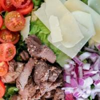 Arugula Steak Salad · baby greens, sirloin steak, red onion, cherry tomato, shaved parmesan cheese & house dressing