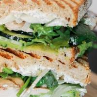 Pressed Green God · grilled chicken, avocado, cucumber, onion, dressed mixed greens, mozzarella cheese & herb ch...