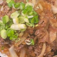 Sukiyaki Beef Don Buri · A bowl containing simmered beef, onion, and egg over steamed rice. Japanese Beef Bowl, is al...