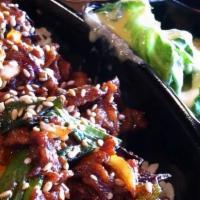 Bulgogi With Rice Bento · Stir-fried bulgogi - beef in a soy sauce marinade and served on a bed of rice.
