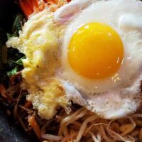 Gal-Bi  Hot Stone Bibimbap · Rice topped with various cooked vegetables, such as spinach, mushrooms and bean sprouts, plu...