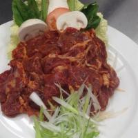 Spicy Pork Loin · Pork tenderloin thinly sliced and marinated with a spicy hot blend of red pepper paste, garl...