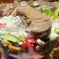 Gyro Salad · Lamb and beef gyro served with mixed greens, cucumber, tomato, onion, pickle, shredded carro...
