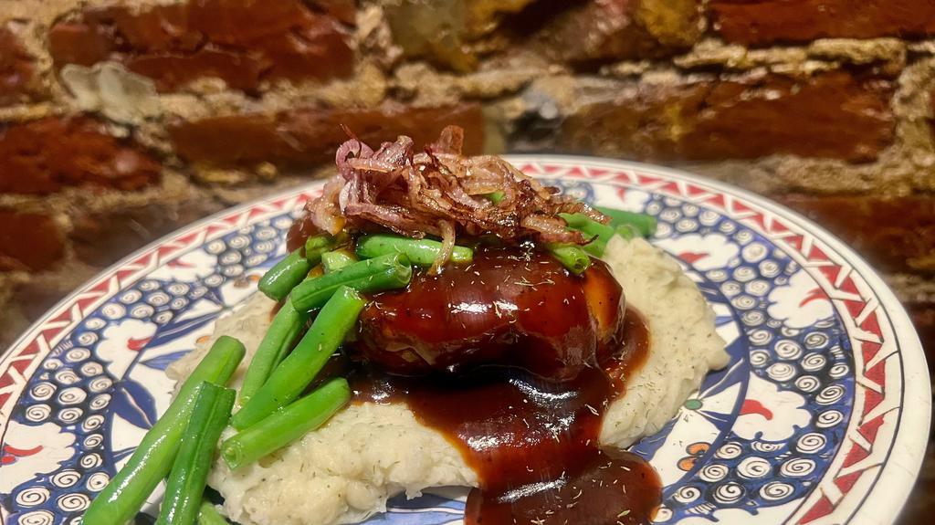 Pomegranate Chicken · Braised chicken breast with pomegranate sauce, caramelized red onions, toasted pistachios over mashed potatoes and green beans.