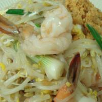 Pad Thai With Shrimps · The most famous Thai noodle dish, fried with shrimps, ground peanuts, egg, bean sprouts, sca...