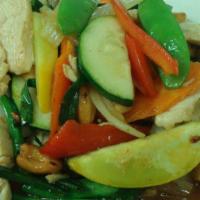 Chicken Cashew Nuts* · Sliced chicken sauteed with roasted cashew nuts, dried chili, onion, mushroom, snow peas, ca...