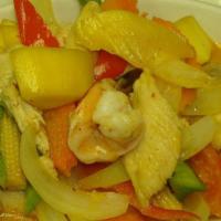 Mango Curry** · Sauteed chicken and shrimps in hot curry sauce with mango, onions, baby corn, mushroom, carr...