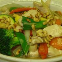 Pine Nuts Chicken · Tender chicken with assorted colorful vegetables in a fragrant soy-ginger sauce, topped with...