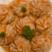 Jhol Momo · 8 pcs steamed homemade dumplings sauced in homemade saseme and cumin based sauce.