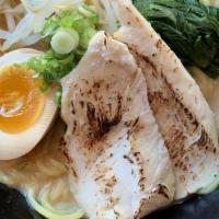 Chicken Yakibuta Ramen · Ramen noodle soup topped with chicken, boiled egg, yu-choy, bean sprouts and scallions.