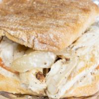 Grilled Chicken Panini · Caramelized onions, provolone, sun-dried tomato paste, and mesclun mix.