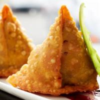 Vegetable Samosa · Crisp pastry filled with russet potato and peas.
