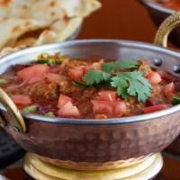 Lamb Roganjosh · Lamb leg cubes with a flavorful sauce of tomato, ginger, black cardamom and bay leaves.