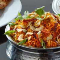 Biryani · Spice infused Basmati rice layered with slow-cooked tomato sauce and your choice of protein.