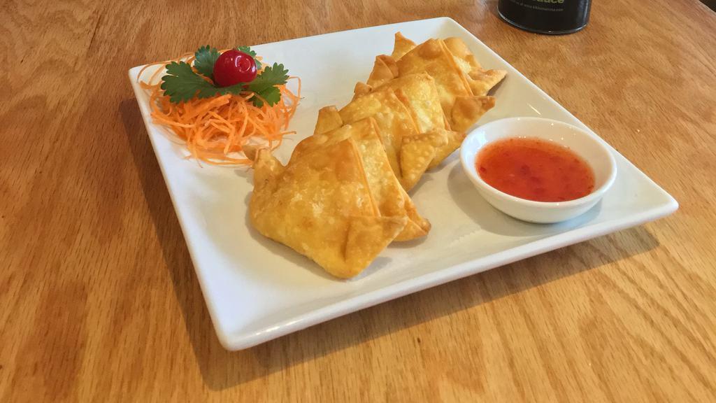 Crab Rangoon · Deep fried Japanese wonton stuffed with crab meat, onion, cream cheese, celery and carrot served with sweet chili sauce. (6 pcs)