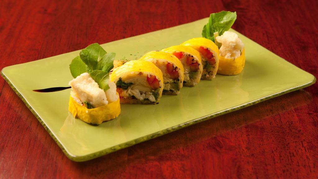 Sunrise Roll · Shrimp tempura and avocado topped with spicy salmon and mango with mango sauce.