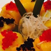 Mango Dragon · Fried eel and asparagus inside with mango and caviar on top.