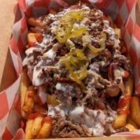 Cheesesteak Fries · Crispy Fries loaded with steak, Cooper sharp cheese, and pickled peppers