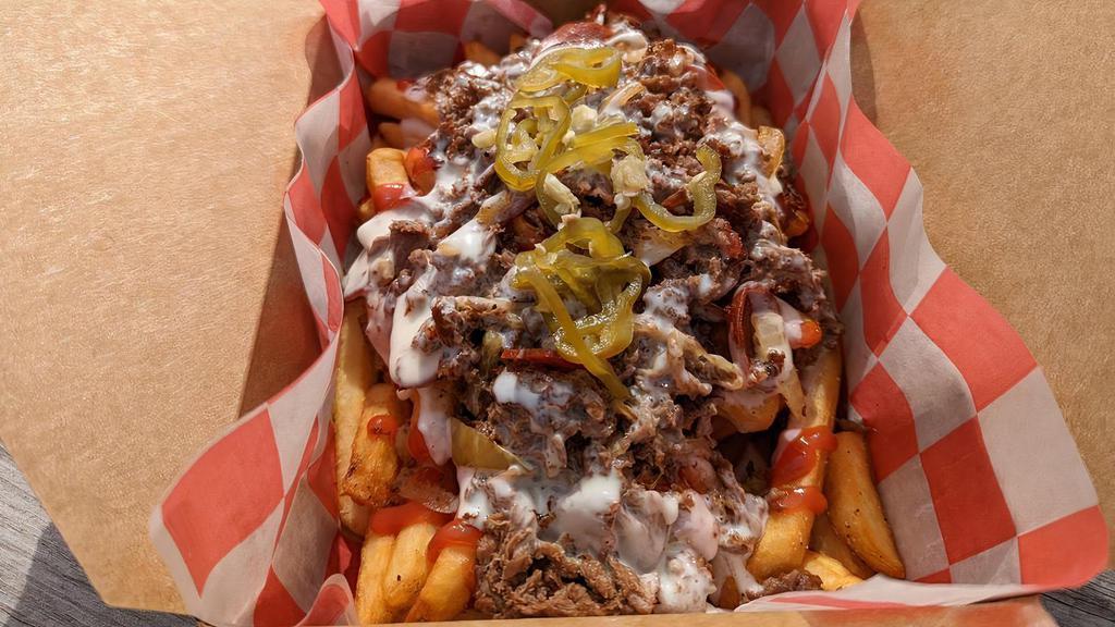 Cheesesteak Fries · Crispy Fries loaded with steak, Cooper sharp cheese, and pickled peppers