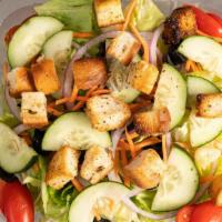Garden Salad · Serves two people. Lettuce, tomato, onion, cucumbers, olives, croutons and carrots.