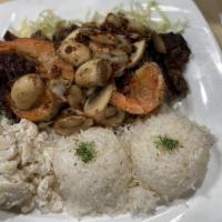 Steak & Shrimp · 10 oz. tender steak, garlic shrimp and sautéed mushrooms, served with rice and French fries ...