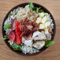 Warmer · Warm Brown Rice and Romaine Lettuce, Tomatoes, Roasted Onions, Cheddar Cheese, Bacon, and Ch...