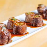 Negimayaki · Pan-seared scallions wrapped in thinly sliced NY strip steak with house-made teriyaki sauce.
