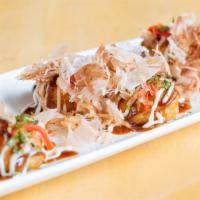 Takoyaki · Octopus dumplings, worcheshire sauce, Japanese mayo, pickled red ginger, bonito flakes and s...