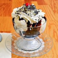Brownie Sundae · Warm brownie, topped with two scoops of  ice cream, hot fudge, whipped cream, and chocolate ...