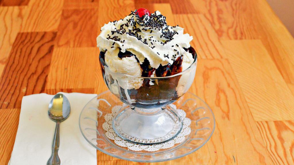 Brownie Sundae · Warm brownie, topped with two scoops of  ice cream, hot fudge, whipped cream, and chocolate sprinkles.