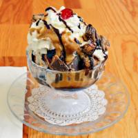 Peanut Butter Hot Fudge Sundae · Two scoops of Peanut Butter Cup ice cream, peanut butter sauce, hot fudge, whipped cream and...