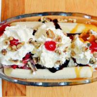 Banana Split · Vanilla, chocolate and strawberry ice cream, caramel, strawberries and hot fudge topped with...