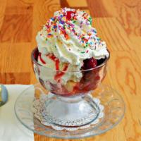 Strawberry Shortcake Sundae · Warm yellow cake, topped with two scoops of vanilla ice cream, strawberry topping, whipped c...