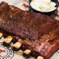 St Louis 1/2 Rack · St. Louis cut pork ribs, rubbed, smoked and served with white bread, a taste of apple slaw o...