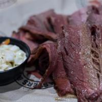 Luckenbach Texas Prime Brisket · Thoroughly rubbed, smoked and served with white bread, a taste of apple slaw or 