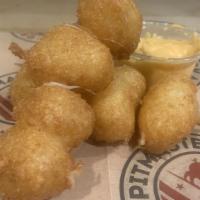 Fried Cheese Curds · Wisconsin Cheese Curds. Lightly Battered and Fried. Served on skewers with choice of Buffalo...