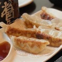 Pork Gyoza · Pan fried dumplings.