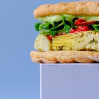 Veggiemeister Panini · Pressed and toasted fresh ciabatta with roasted artichoke and peppers, arugula, sun dried to...