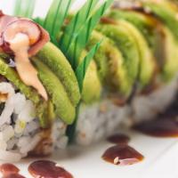 Rocky Maki · Eel, tobiko & cucumber roll with avocado wrapped on the outside. 
Contains Raw Fish.