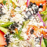Greek Salad · House salad with feta cheese, black olives and served with Greek dressing on the side.