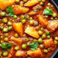 Aloo Mutter · Vegetarian. Spiced curry with green peas and potatoes.