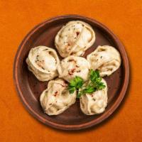 Dunked Dumpling Delight · These dumplings are dunked in our delicious gravy sauce with a curry like consistency. Once ...