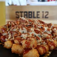 Bbq Tots · Pork, Chicken or Brisket over tots, topped with cheddar jack cheese, and finished with your ...