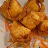 Crab Rangoon · Favorite. Wonton filled cream cheese, crab meat, and chopped onion. Served with special swee...