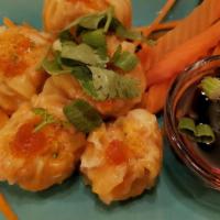 Shumai · Shumai filled with shrimp and vegetables. Served with ginger sauce.