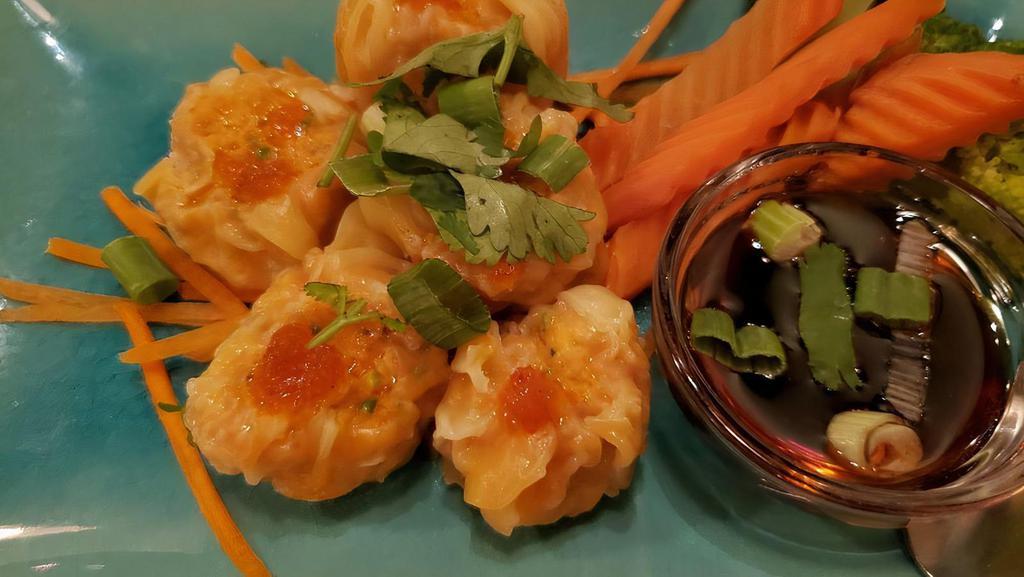 Shumai · Shumai filled with shrimp and vegetables. Served with ginger sauce.