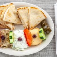 Appetizer Sampler Platter · A great variety including hummus, tzatziki, baba-ganoush (melitzanosalata), dolmathakia. Ser...