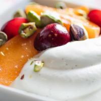 Greek Yogurt · Thick and creamy Greek yogurt topped with honey and walnuts.